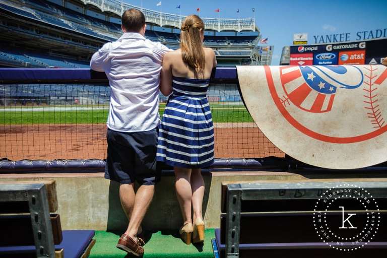 engaged couple in dugout at yankee stadium - looking onto field