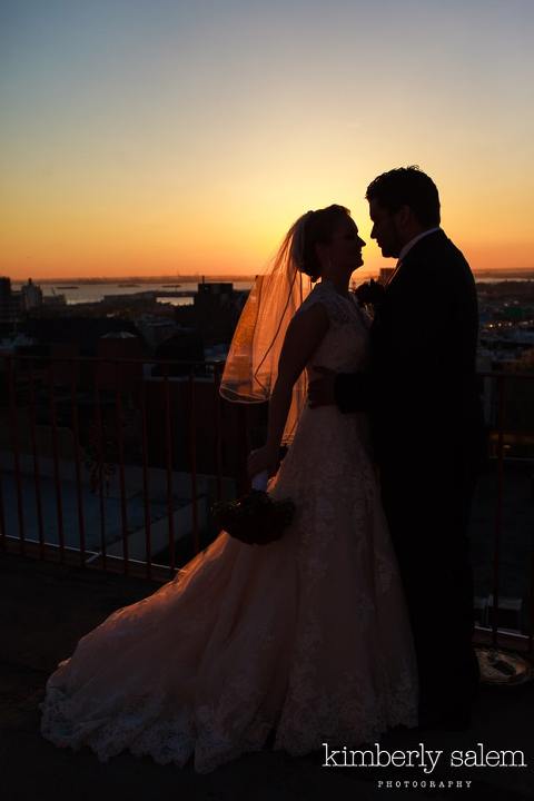 bride and groom silhouette at sunset